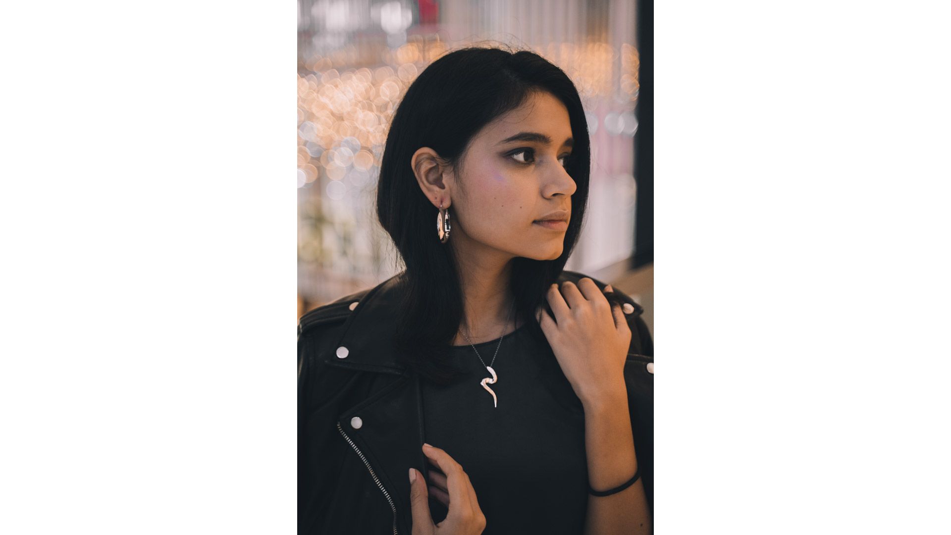 A person looking away from the camera

Description automatically generated