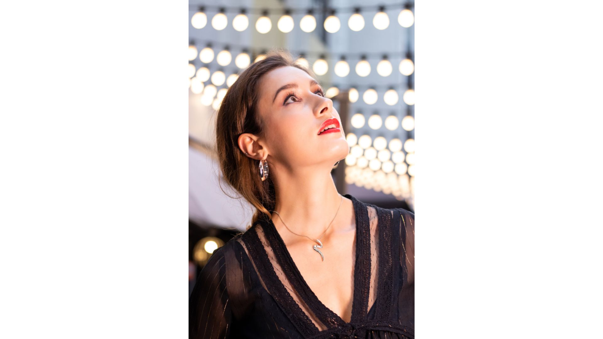 A person looking up to the sky

Description automatically generated