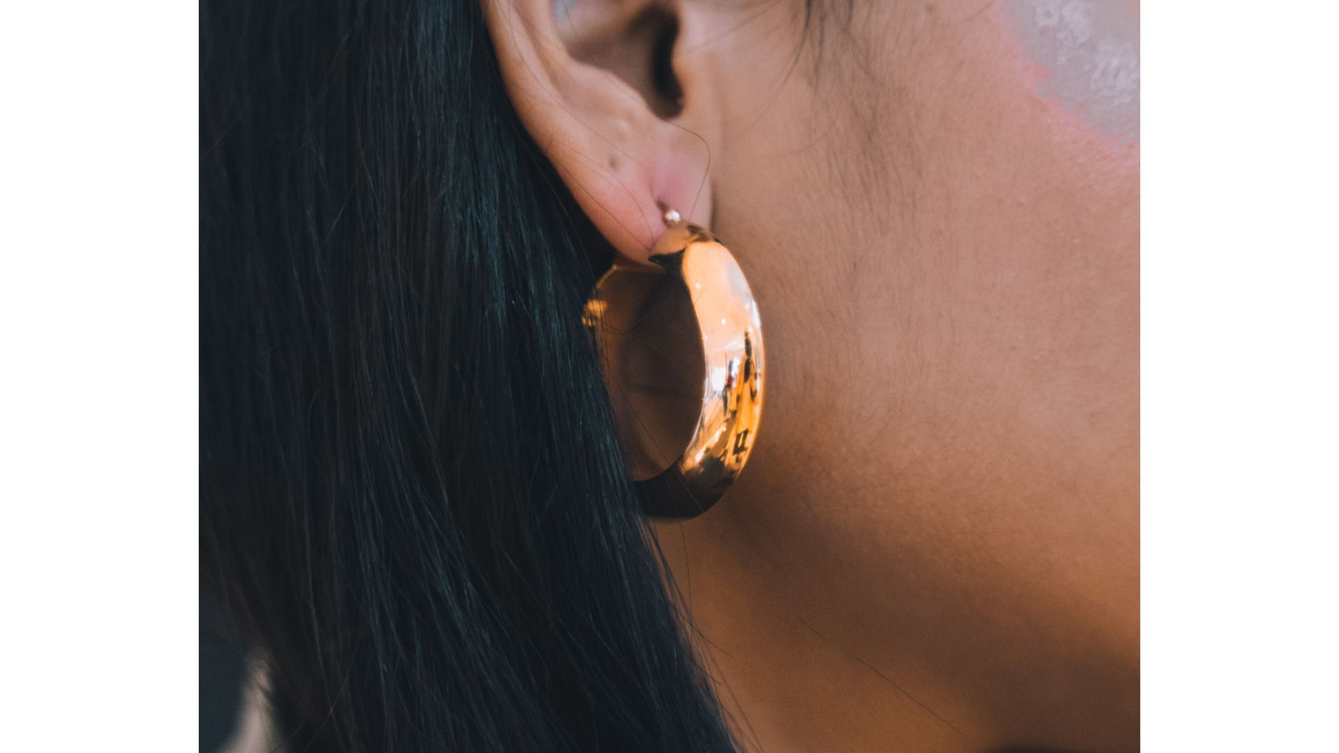 A close up of a person's ear

Description automatically generated