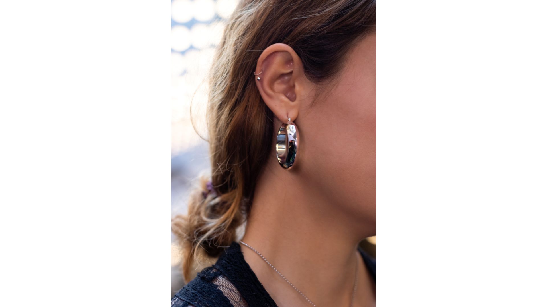 A close-up of a person's ear

Description automatically generated